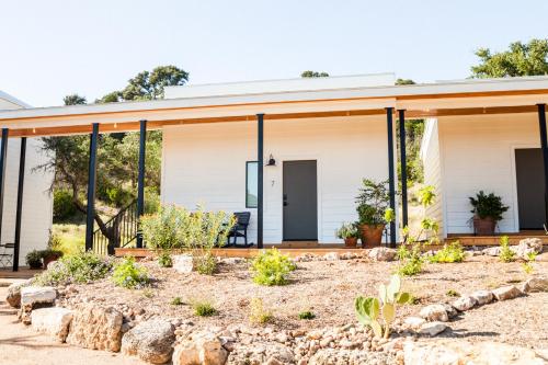 a house with a wrap around porch at Contigo Ranch Fredericksburg in Fredericksburg