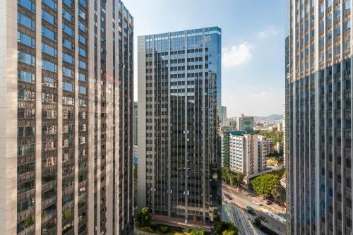 an aerial view of tall buildings in a city at Yumi Apartment Lida Plaza Branch in Guangzhou