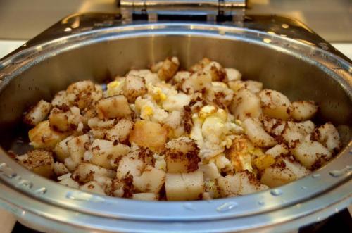 a pot full of potatoes in a pan at eHome Hotel in Taoyuan