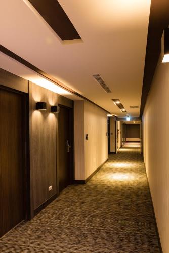 a hallway of an office building with a long corridor at V-Hotel in Taitung City
