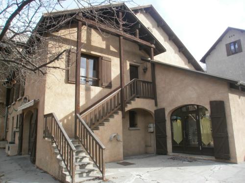 a house with stairs on the side of it at Cap Verb Guillestre in Guillestre