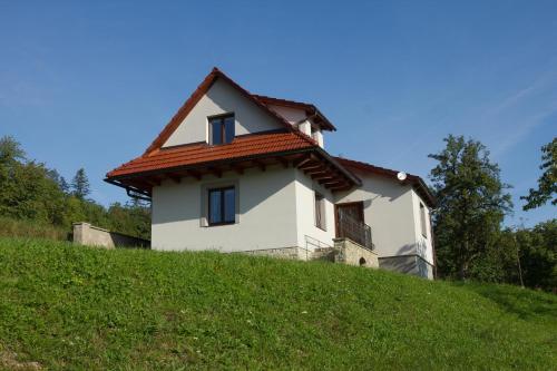 a small house on top of a hill at Chalupa pod Hruškou in Zubří