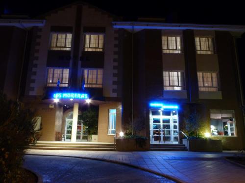 a hotel with blue lights on the front of it at Hotel Las Moreras in León