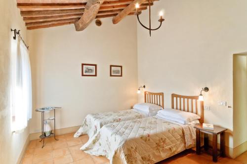 Кровать или кровати в номере Agriturismo Le Macchie