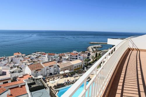 a view of the ocean from the balcony of a resort at Boa Vista Hotel & Spa - Adults Only in Albufeira