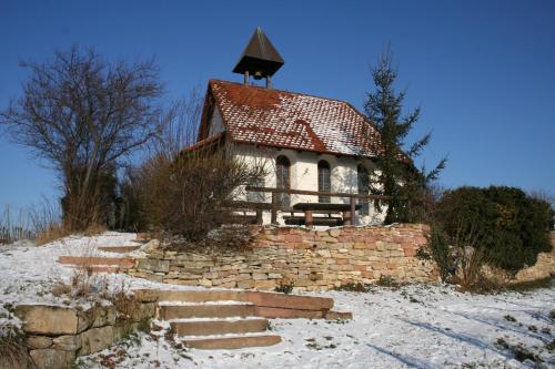 a small brick building with a tower on top of it at Mercure Hotel Bad Duerkheim An Den Salinen in Bad Dürkheim