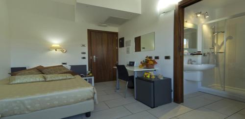 Katil atau katil-katil dalam bilik di Hotel La Locanda