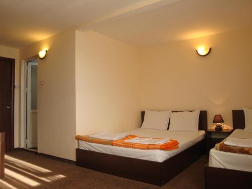 a room with two beds in a room at Family Hotel Diana in Lyaskovo
