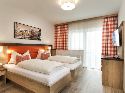 Katil atau katil-katil dalam bilik di Apartments & Garni Alpenrose