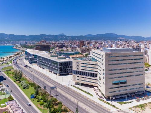an aerial view of a city with a highway at Melia Palma Bay in Palma de Mallorca