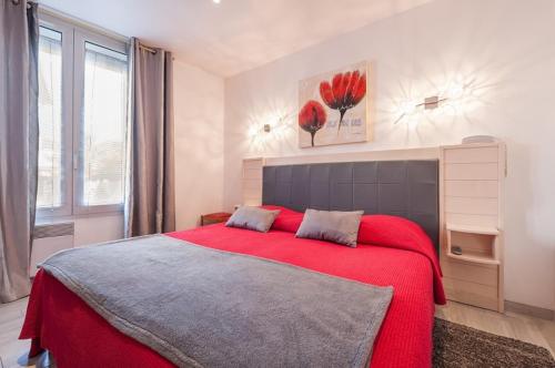 Ένα ή περισσότερα κρεβάτια σε δωμάτιο στο Hôtel de la Plage