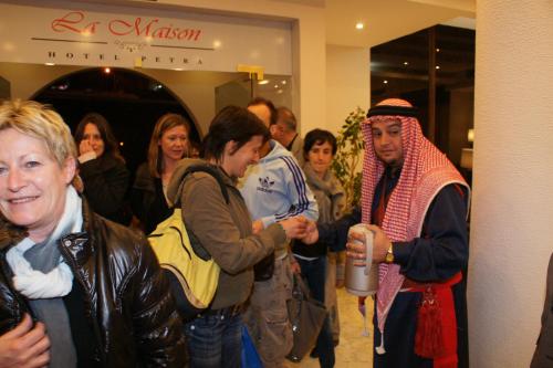 a group of people standing around in a store at La Maison Hotel in Wadi Musa