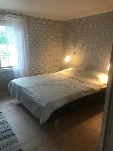 Ένα ή περισσότερα κρεβάτια σε δωμάτιο στο Nicoll-huset