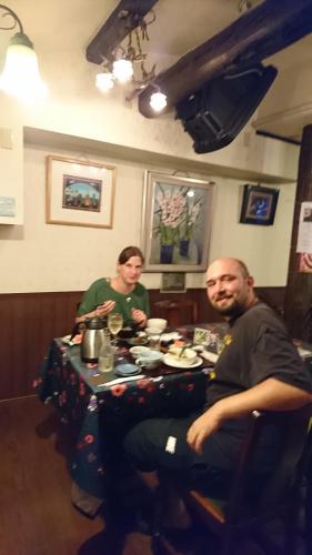 a couple of people sitting at a table at Live Cafe Hisui no Umi in Itoigawa