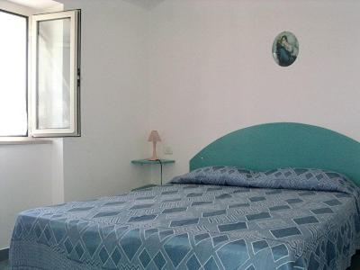 Ένα ή περισσότερα κρεβάτια σε δωμάτιο στο BLUS MARINE HOME a 10mt dalla SPIAGGIA