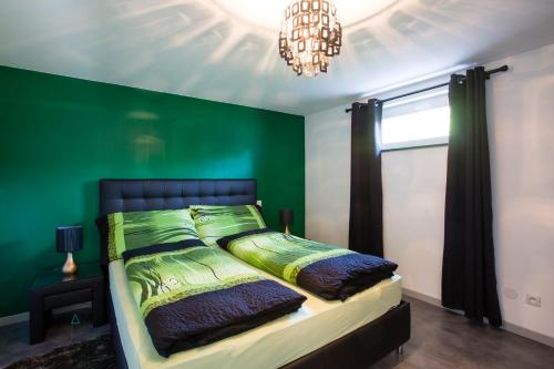 Postel nebo postele na pokoji v ubytování La Halte des Vignes - Route des vins d'Alsace