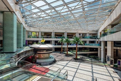 arium of a building with a glass ceiling at Regal Airport Hotel in Hong Kong