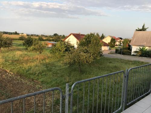 a view of a field with houses and a fence at Victoria Appartement in Kappel-Grafenhausen