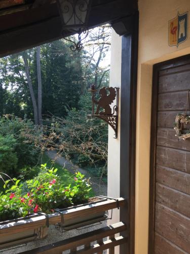 a window view of a garden from a house at B&B San Martino in Mede