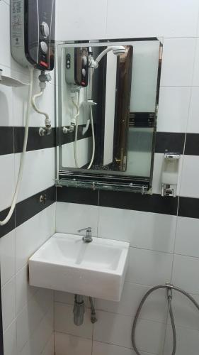 Koupelna v ubytování Hotel Paka INN