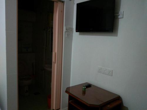 TV a/nebo společenská místnost v ubytování Hotel Paka INN