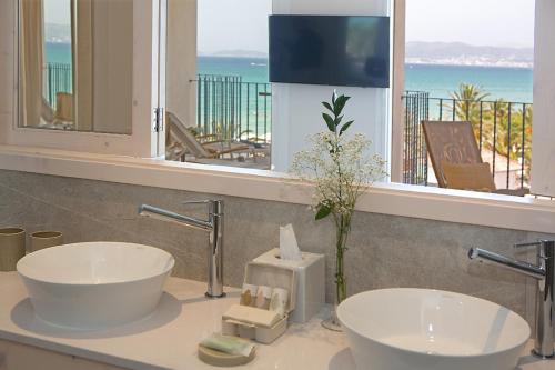 a bathroom with two sinks and a view of the ocean at Myseahouse Flamingo - Adults Only 4* Sup in Playa de Palma