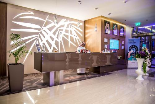 a lobby with a reception desk in a store at Novotel Yanbu Albahr in Yanbu