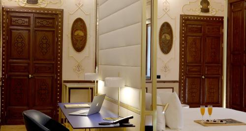 a room with a desk with a laptop on it at Axel Hotel Madrid - Adults Only in Madrid