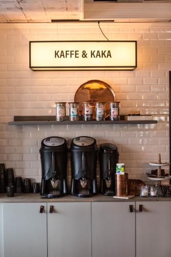 a kitchen with two coffee pots on a counter at Stadshotellet Lidköping in Lidköping