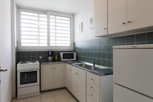 Una cocina o zona de cocina en Delice Hotel - Family Apartments