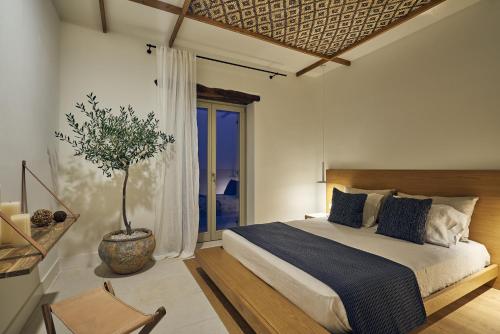 A bed or beds in a room at Niova Villa - Seafront, private pool and Ionian Sea Views, by ZanteWize