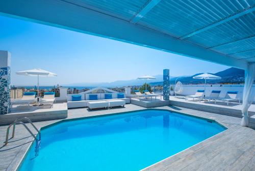 a swimming pool on the roof of a building at Senses Blue Boutique hotel in Hersonissos