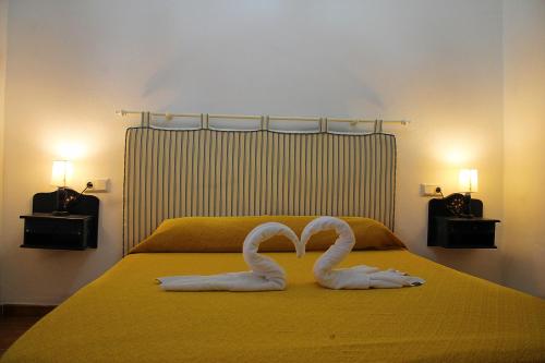 A bed or beds in a room at Casa Rural Molino de la Máquina