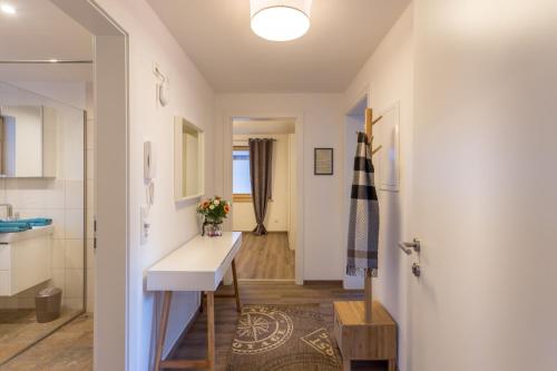 a kitchen with a counter and a sink in a room at Alpen Appartement BelEtage in Mayrhofen