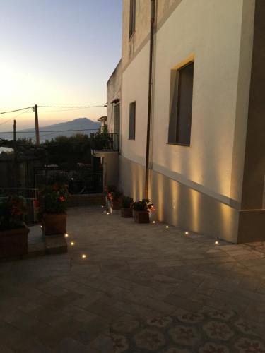 a building with lights on the side of it at L'antica Pigna Chateau in Vico Equense