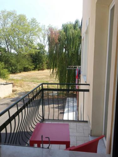 a balcony with a view of a tree at Residence Shopping Outlet in Novi Ligure