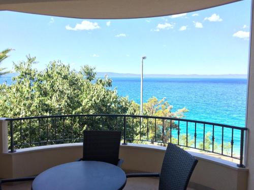 a balcony with a view of the ocean at Apartments Nevenka i Josko in Tučepi