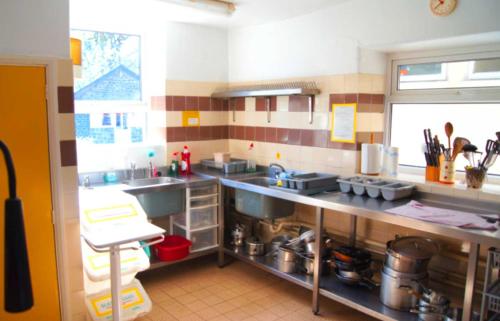 a kitchen with a sink and a counter top at Woodlands Centre in Betws-y-coed