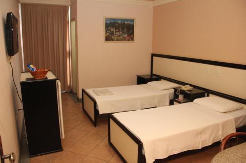 Giường trong phòng chung tại Hotel Primavera