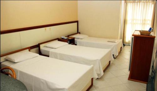 Postel nebo postele na pokoji v ubytování Hotel Primavera