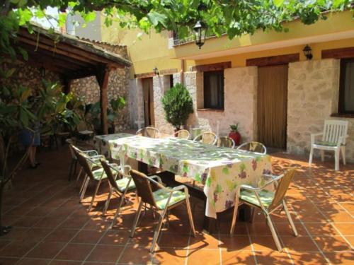 a table and chairs sitting on a patio at Casa Rural Blas in Brihuega