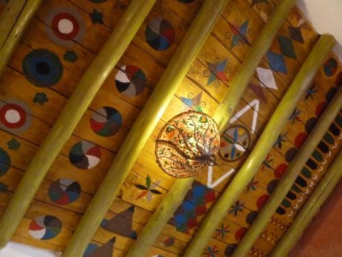 a ceiling with a chandelier hanging from it at Riad Cascades d'Ouzoud in Ouzoud