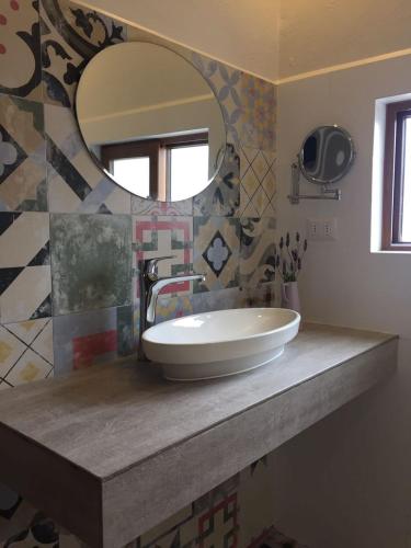 a bathroom with a sink and a mirror at Hotel Boutique BC Wine Casablanca in Casablanca