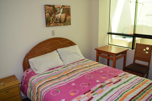 Cama o camas de una habitación en Kuski Hospedaje