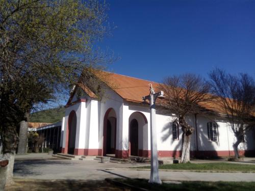 a white and red church with a cross in front at Hotel Boutique BC Wine Casablanca in Casablanca