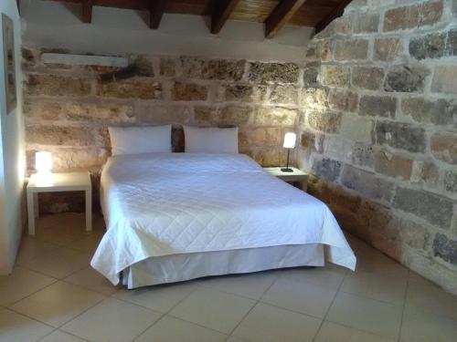 Łóżko lub łóżka w pokoju w obiekcie Casetta Vacanza in Campagna
