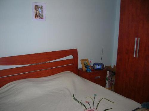 Кровать или кровати в номере Stanza matrimoniale con balcone e bagno condiviso