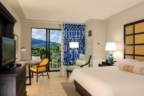 Postel nebo postele na pokoji v ubytování Wyndham Grand Rio Mar Rainforest Beach and Golf Resort