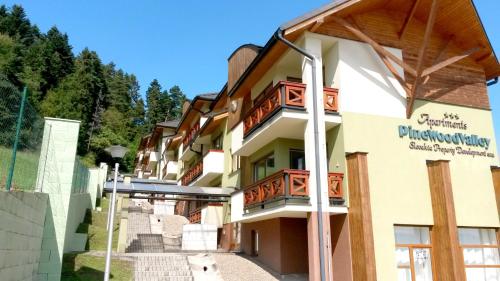 a building on the side of a mountain at Pine Wood Apartment in Vyšné Ružbachy