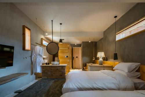 Shangri-La Karesansui Hotelにあるベッド